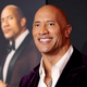 Dwayne Johnson smiles, as Dwayne Johnson sternly looks on